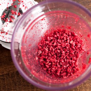 Frozen raspberries run through a mixer