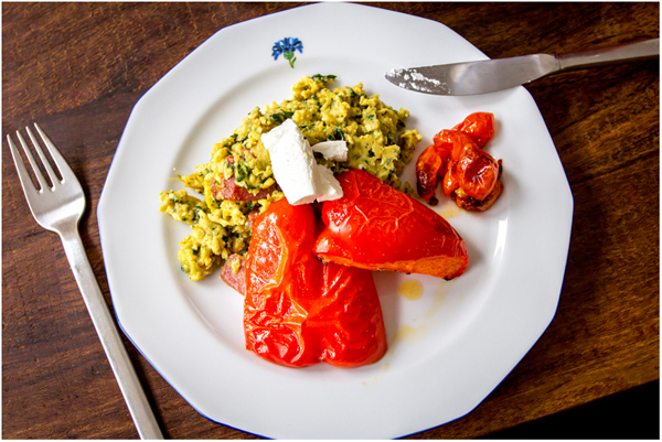 scrambled eggs with spinach, roasted bell pepper, tomatoes and goat cheese