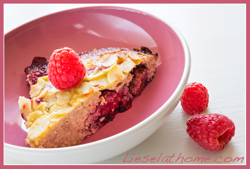 cake in pink bowl with raspberries