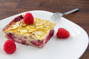 plate with cake and raspberries