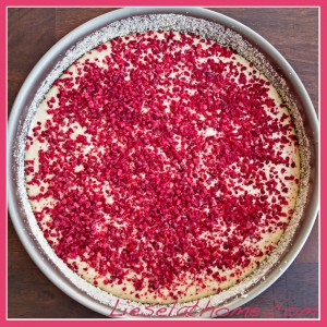 Cheesecake with raspberry sprinkle before going into the oven