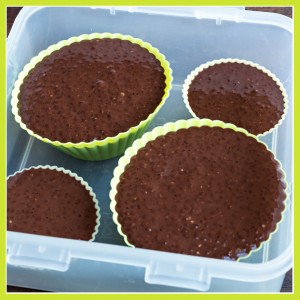 box with muffin forms filled with creamy chocolate chia pudding