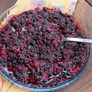 thawed berries with coconut oil and chia seeds - leave to soak