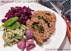 plate with meatloaf served with red cabbage and green beans