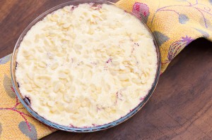 pour the pie crust over the berries