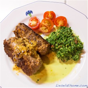 plate with mini meatloaves and kale