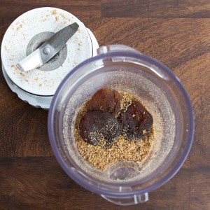 grinder with ground flaxseeds and dried apricots