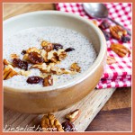 chia seed vanilla pudding with a topping of nuts and raisins