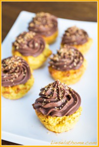 orange cupcakes with chocolate topping and orange coconut sprinkles