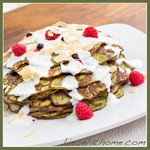 Grain free spinach pancakes, stacked, with berry jam in between